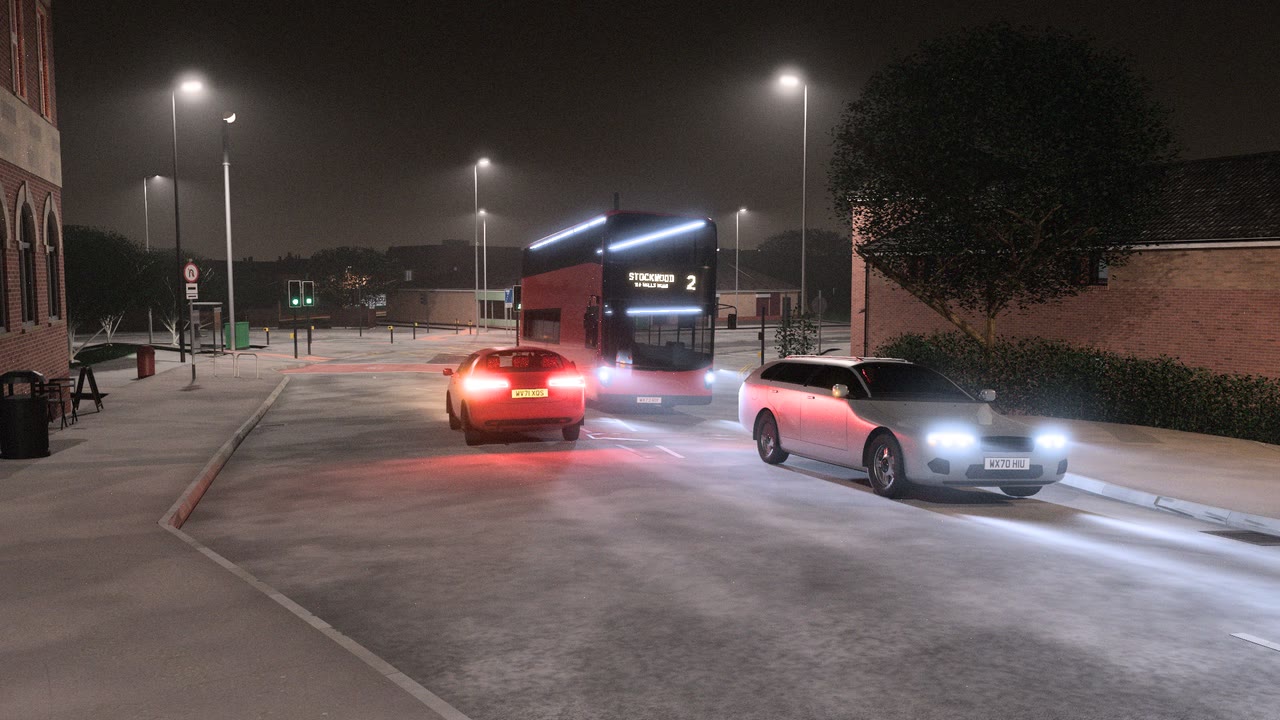 A street at night rendered by VeriStreet: street lights glowing in light mist, a red double-deck bus with a lit destination display, a car with red tail lights and an estate car with headlights lighting the road, kerbs, signals and brick buildings.
