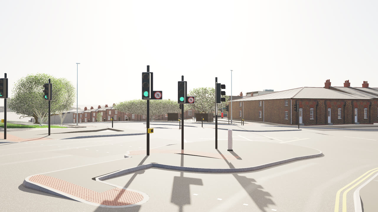 Traffic signals rendered by VeriStreet: signal heads on black poles, two showing green beside no U-turn signs, a push-button unit, tactile paving on a kerbed island, and red-brick terraces and trees beyond.